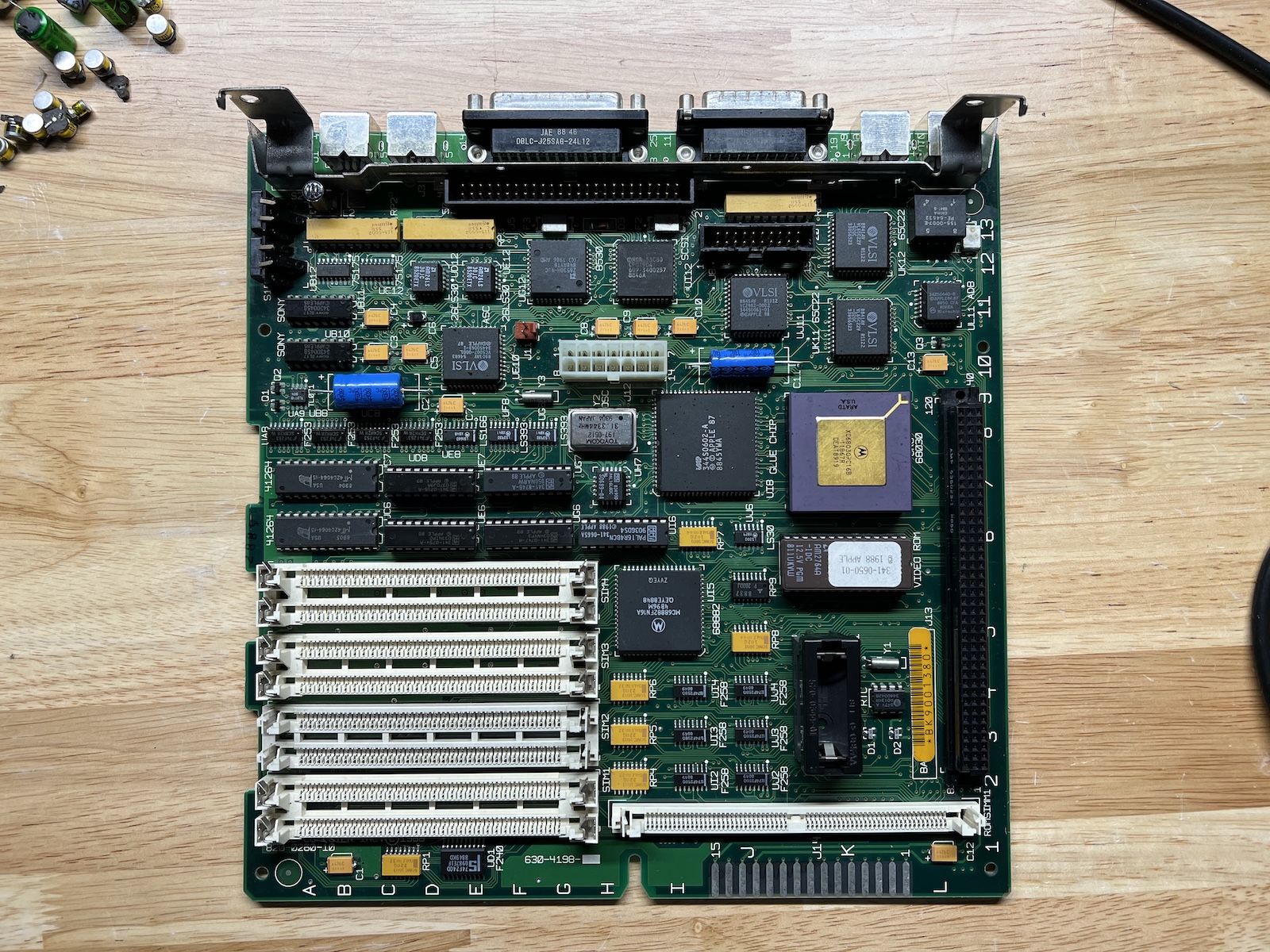 A Macintosh SE/30 logic board with all the new capacitors installed.